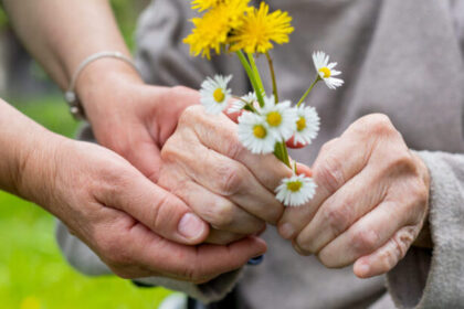 Hands holding flowers